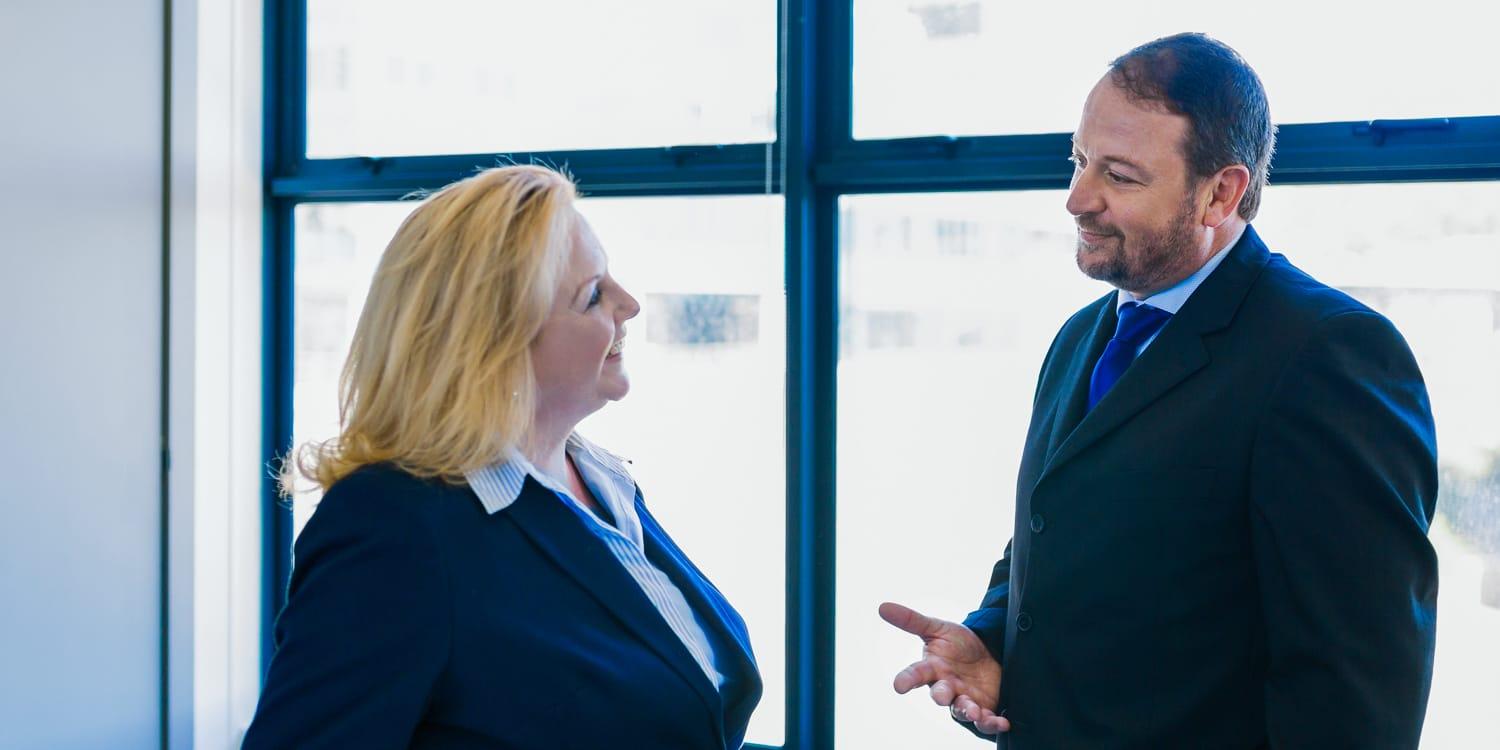 Two of the directors of DSC Attorneys conversing.